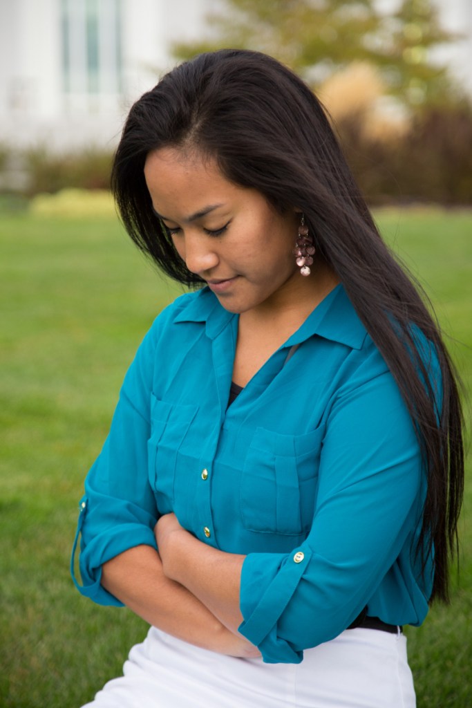 Woman Prays in Front of Temple